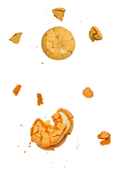 istock Broken macaron and several macaron pieces are scattered on isolated background. 2209059866