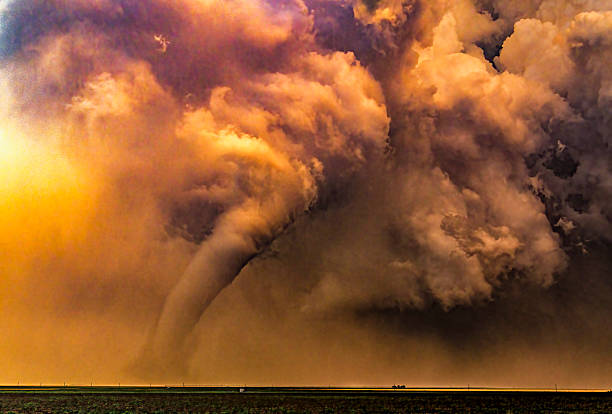 istock Sunset tornado at sunset in rural area 2209061381
