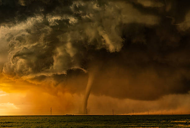 istock Sunset tornado at sunset in rural area 2209061470