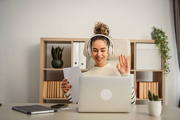 istock One young woman making a video call on a laptop at work in the office 2209062892