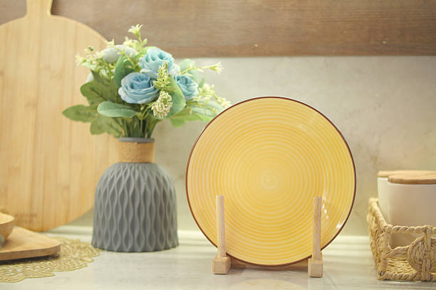 istock Elegant yellow plate with decorative flowers on a beautiful background 2209064900