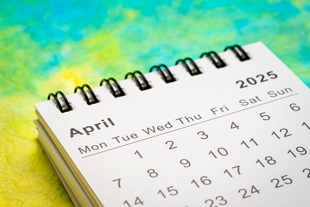 istock April 2025 - small spiral desktop calendar, time and business concept 2209065415