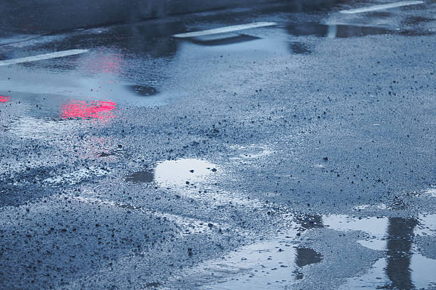 istock Reflections observed on the wet pavement after a rain shower has ended 2209066191