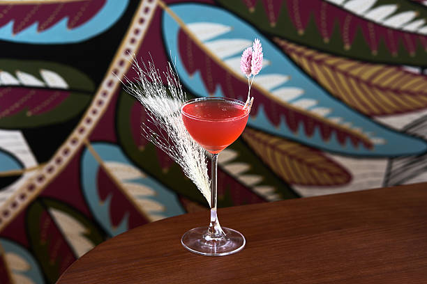 istock Red Tropical Cocktail with Floral Garnish 2209066314