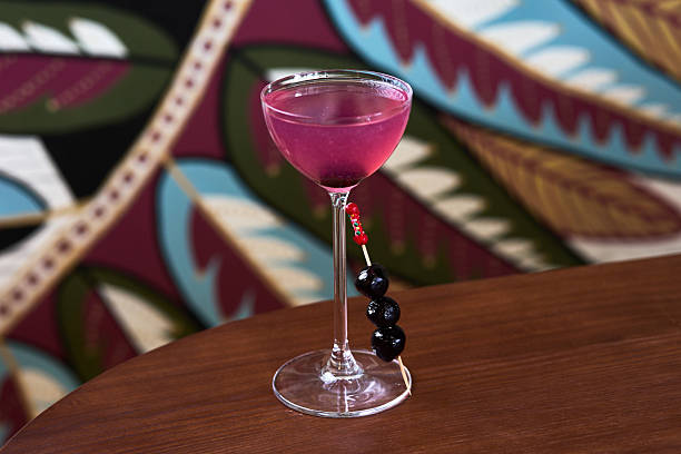 Pink Tropical Cocktail with Berry Garnish