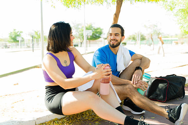 istock Runners resting and talking after workout in a park 2209069172