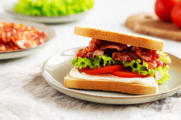 istock Homemade BLT Sandwich (Bacon, Lettuce and Tomato) on a Plate, side view. 2209069353