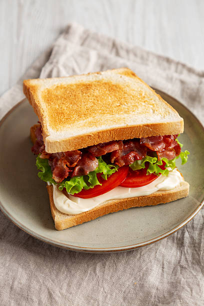 istock Homemade BLT Sandwich (Bacon, Lettuce and Tomato) on a Plate, side view. 2209069386