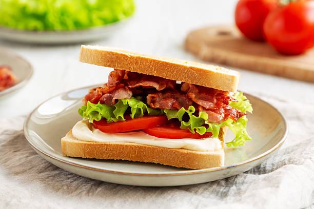 istock Homemade BLT Sandwich (Bacon, Lettuce and Tomato) on a Plate, side view. 2209069412