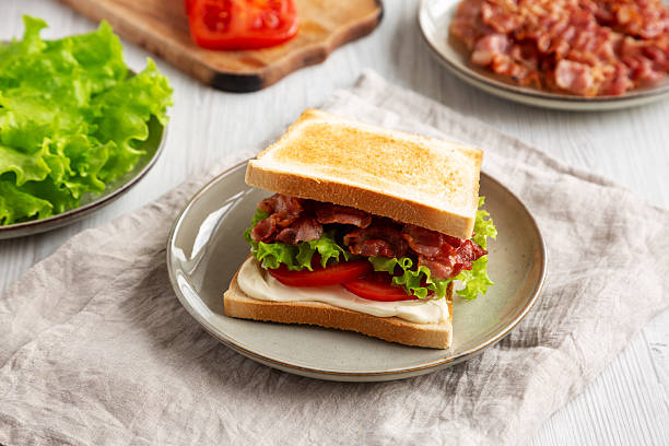 istock Homemade BLT Sandwich (Bacon, Lettuce and Tomato) on a Plate, side view. 2209069419