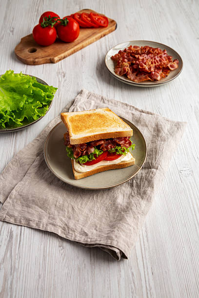istock Homemade BLT Sandwich (Bacon, Lettuce and Tomato) on a Plate, side view. 2209069432