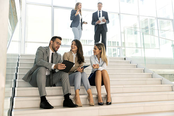 istock Business team sitting and having fun together 2209071372