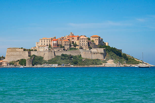 The main attraction of city of Calvi on the island of Corsica is probably its massive walled citadel, which juts out into the Mediterranean sea to overlook and guard the old port