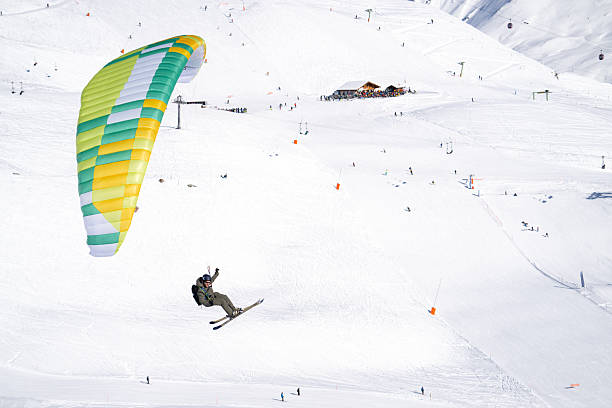 istock Speed flier lands on ski slope 2209075605