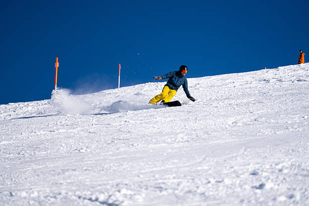 istock Snowboarder descends mountain, Swiss Alps 2209076831
