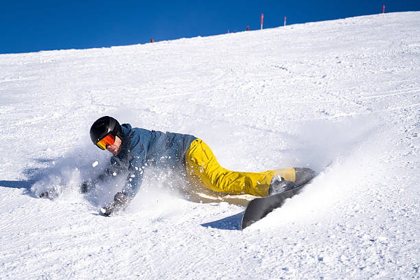 istock Snowboarder descends mountain, Swiss Alps 2209076876