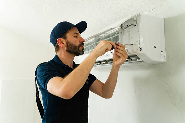 istock Technician repairing air conditioning unit with screwdriver 2209077772