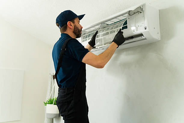 istock Technician cleaning air conditioner filter during maintenance service 2209077798