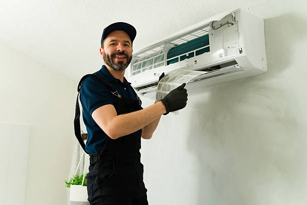 istock Hvac technician cleaning air conditioner filter during maintenance service 2209077816