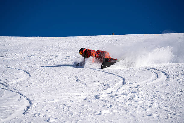 istock Snowboarder descends mountain, Swiss Alps 2209079278