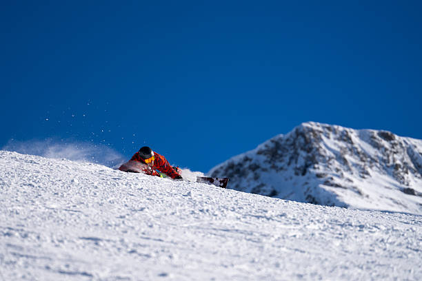 istock Snowboarder descends mountain, Swiss Alps 2209079408