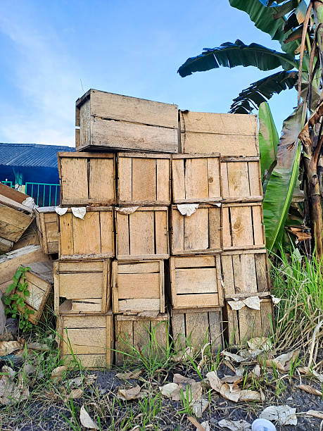 istock pile of used wooden boxes 2209079745