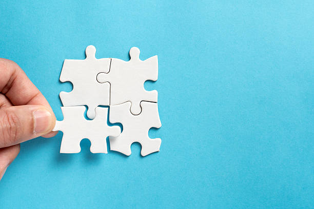 istock Four pieces of plain white jigsaw puzzle for business concept 2209084027