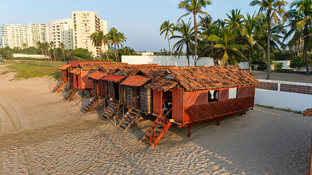 Varosha, Famagusta, Northern Cyprus-May 09,2024:People Enjoying day by the White Painted Huts