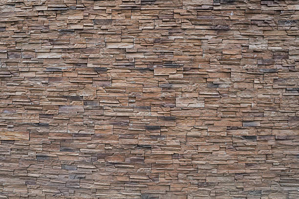 istock Concrete facade stone in beige and brown color. 2209096421