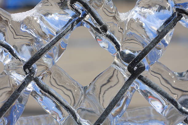 An ice storm hit Gaylord Michigan leaving all of the city, and much of the state covered in a thick layer of ice. When this fence is hit with sun light just right is creates a prism reflection that makes it look like crystal. The gem like look creates a beautiful natural phenomenon.