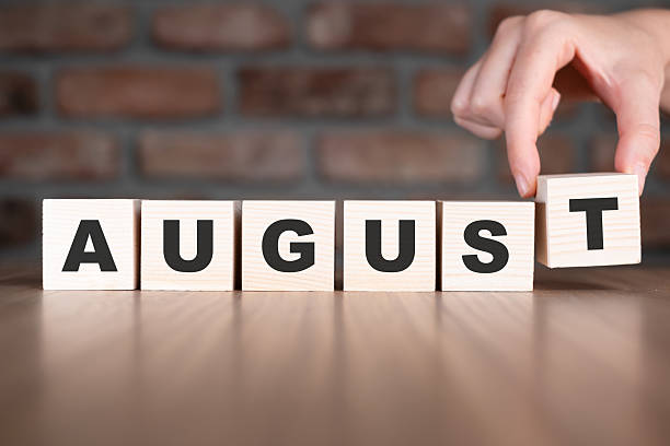 istock August word with wooden blocks on table 2209112450