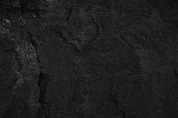 istock A textured stone background showcasing a brutal, monolithic rock formation with cracks and fragments. 2209113196