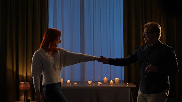 istock Romantic Evening by Candlelight for a Couple Dancing Together 2209116766