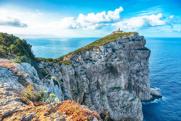 istock Unbelivable morning view on Cacccia cape Lighthouse. 2209121506