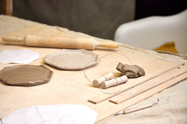 istock on a wooden table there is a blank for a handmade clay plate and tools for clay processing 2209122696