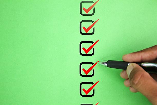 istock hand and pen checking the correct box. Check mark concept. the concept of checking 2209124392