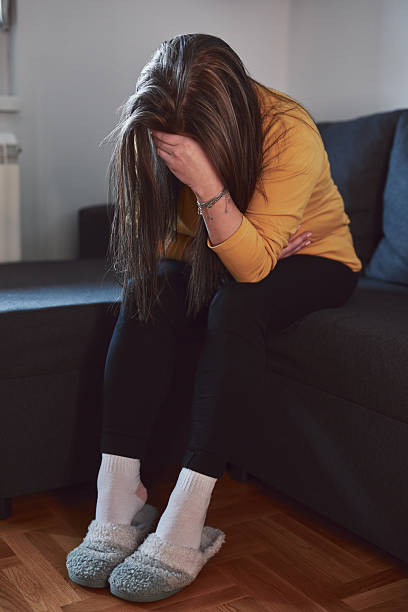 istock Woman with strong stomach ache, menstrual and digestive issues at home. 2209124510