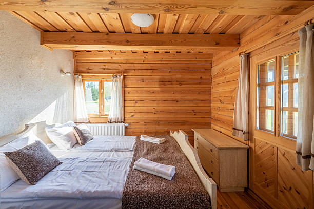 Cozy Wooden Cabin Bedroom Interior With Rustic Decor and Natural Lighting