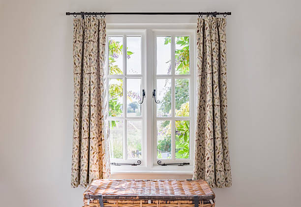 istock Traditional window with curtains in a UK period home interior 2209125413