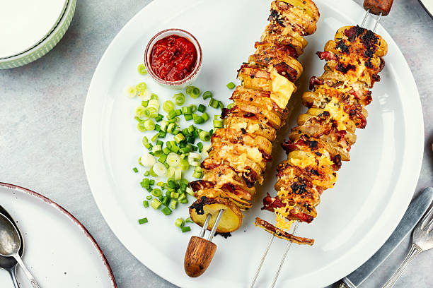 istock Potatoes with bacon on skewers, summer barbecue. 2209125721