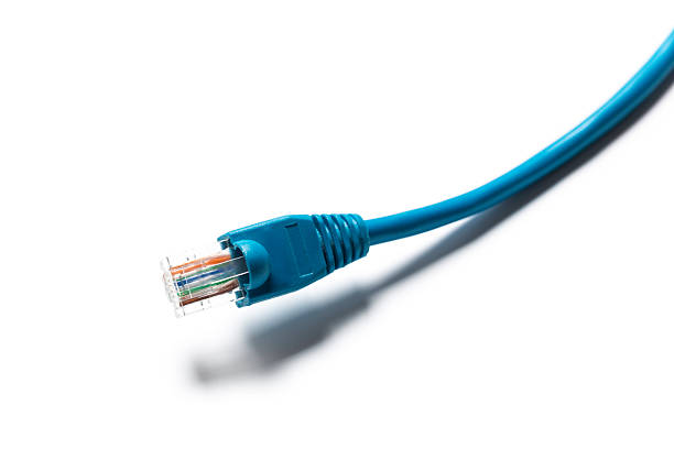 Connector rg 45 for internet cable. Several connectors lie on a multi-colored background. Close-up