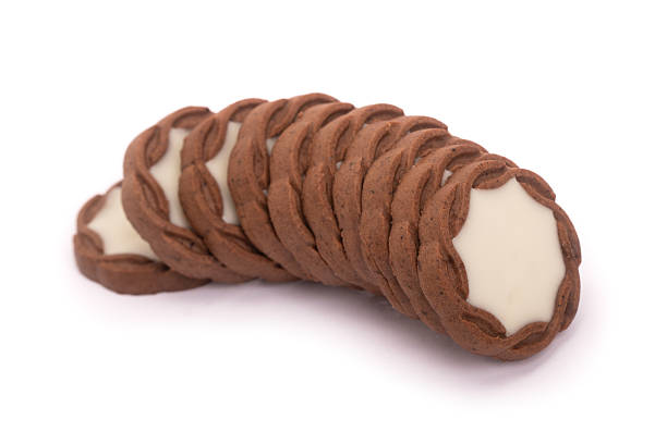 Group of cookies with cream, tasty pastries isolated over white background