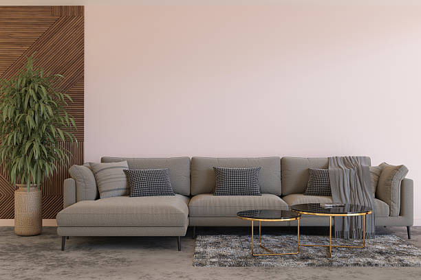 istock A stylish interior featuring a modern sofa paired with intricate cushions and a decorative table. The blank wall provides ample copy space for displaying art or pictures, enhancing the ambiance. 3D. 2209128019