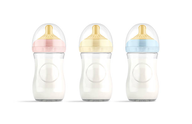 Blank white baby bottle with milk colored nipple mockup, isolated, 3d rendering. Empty pink, yellow and blue nursing for children mock up, front view. Clear bottles for newborn feeding template.