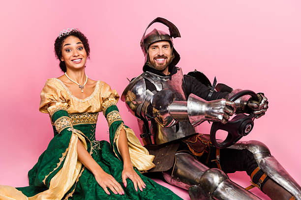 istock Couple Dressed as Medieval Royalty and Knight in a Colorful Theme Party Setting 2209128549