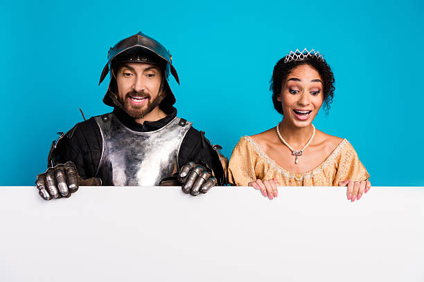 istock A cheerful couple dressed as medieval knight and princess interacting joyfully 2209128649