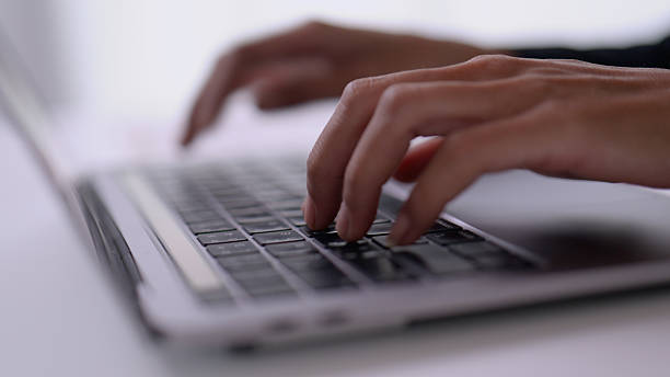 istock Close up Asian woman hand using typing on laptop for working in office. 2209129118