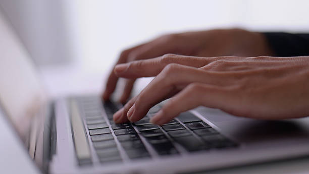 istock Close up Asian woman hand using typing on laptop for working in office. 2209129124