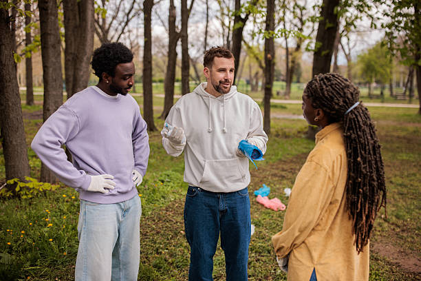 istock People preparing for an environmental cleanup in a wooded area 2209129227