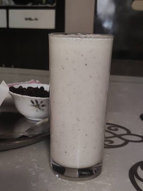 Single straight glass of buttermilk - HD stock photo Milk froth, tall glass. Cooling drink for the summer. Non vegan food. buttermilk mountain stock pictures, royalty-free photos & images